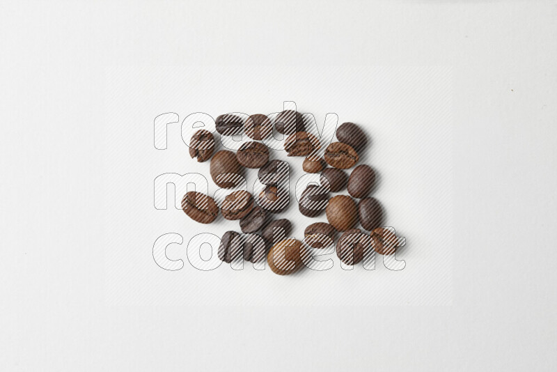 Roasted coffee beans on white background