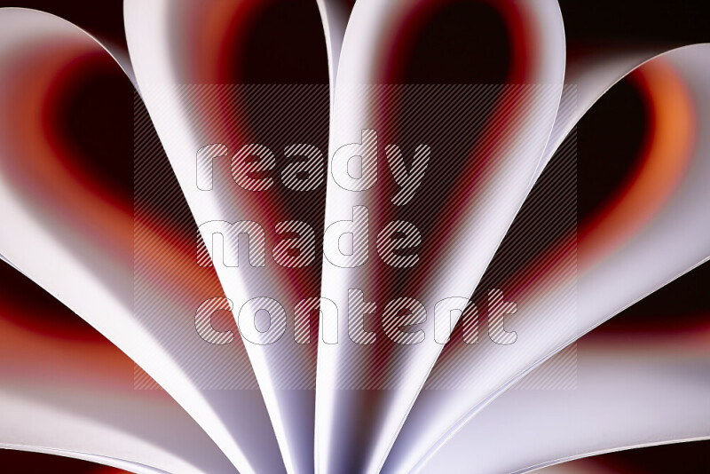 An abstract art piece displaying smooth curves in white and orange gradients created by colored light