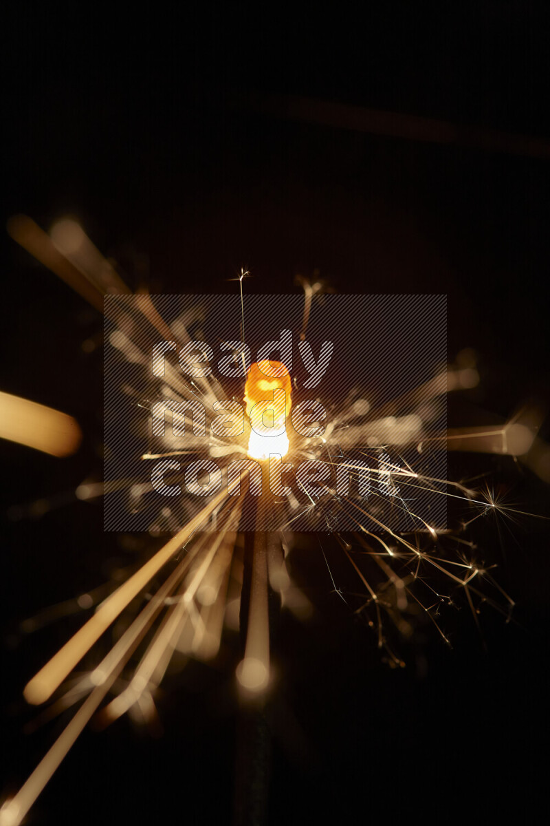 A close-up image of sparkler candle isolated on black background