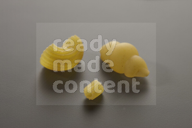 Different pasta types on grey background