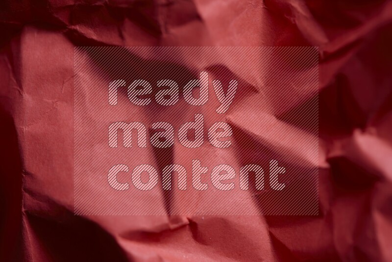 Crumpled craft paper on black background