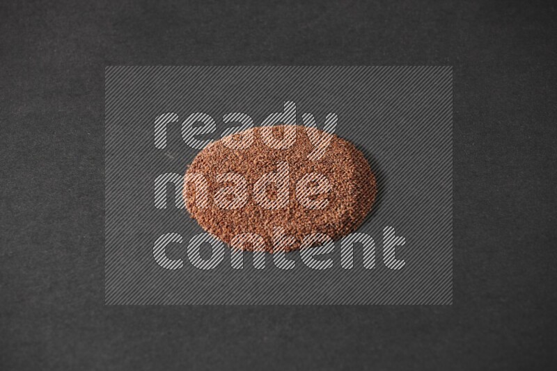 Garden cress seeds in a circle shape on a black flooring