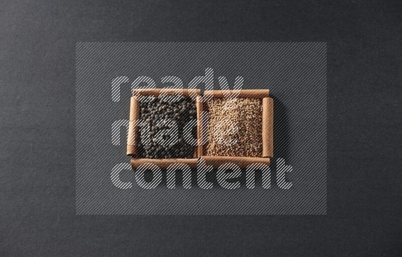 2 squares of cinnamon sticks full of mustard seeds and black peppers on black flooring