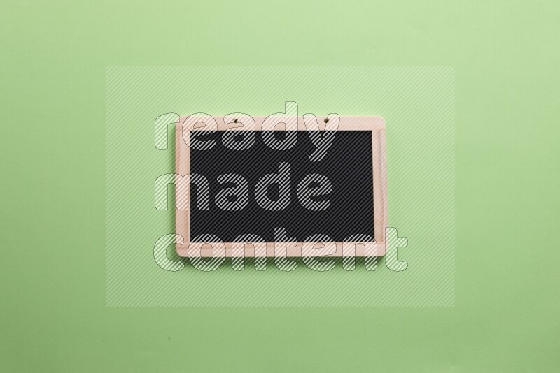 A blackboard on green background