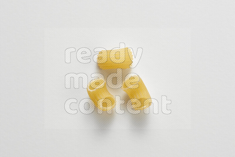 Elbow pasta on white background