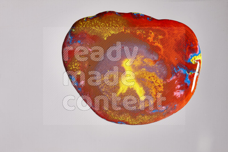 Close-ups of assorted colors blending on a grey background