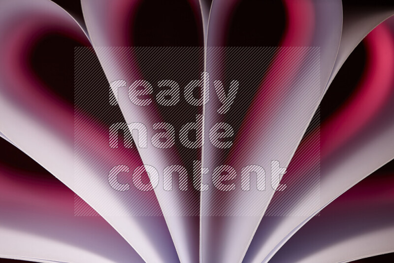 فن تجريدي يعرض منحنيات وتدرجات اللون الوردي مكونه بضوء ملون