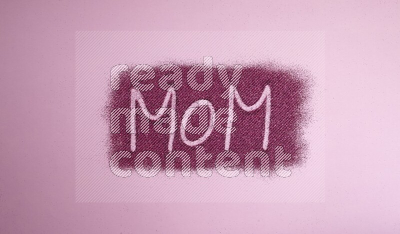 A word written with pink glitter on pink background