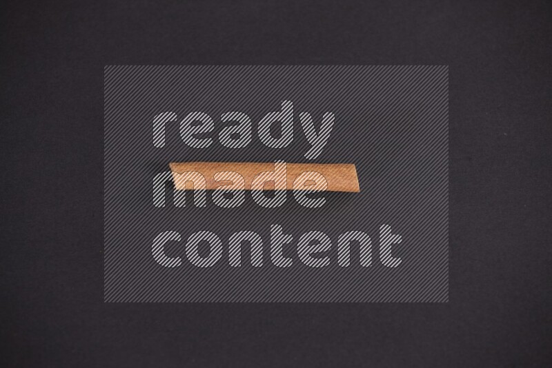 Cinnamon stick on black background
