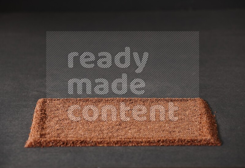 Garden cress seeds filling the frame on a black flooring