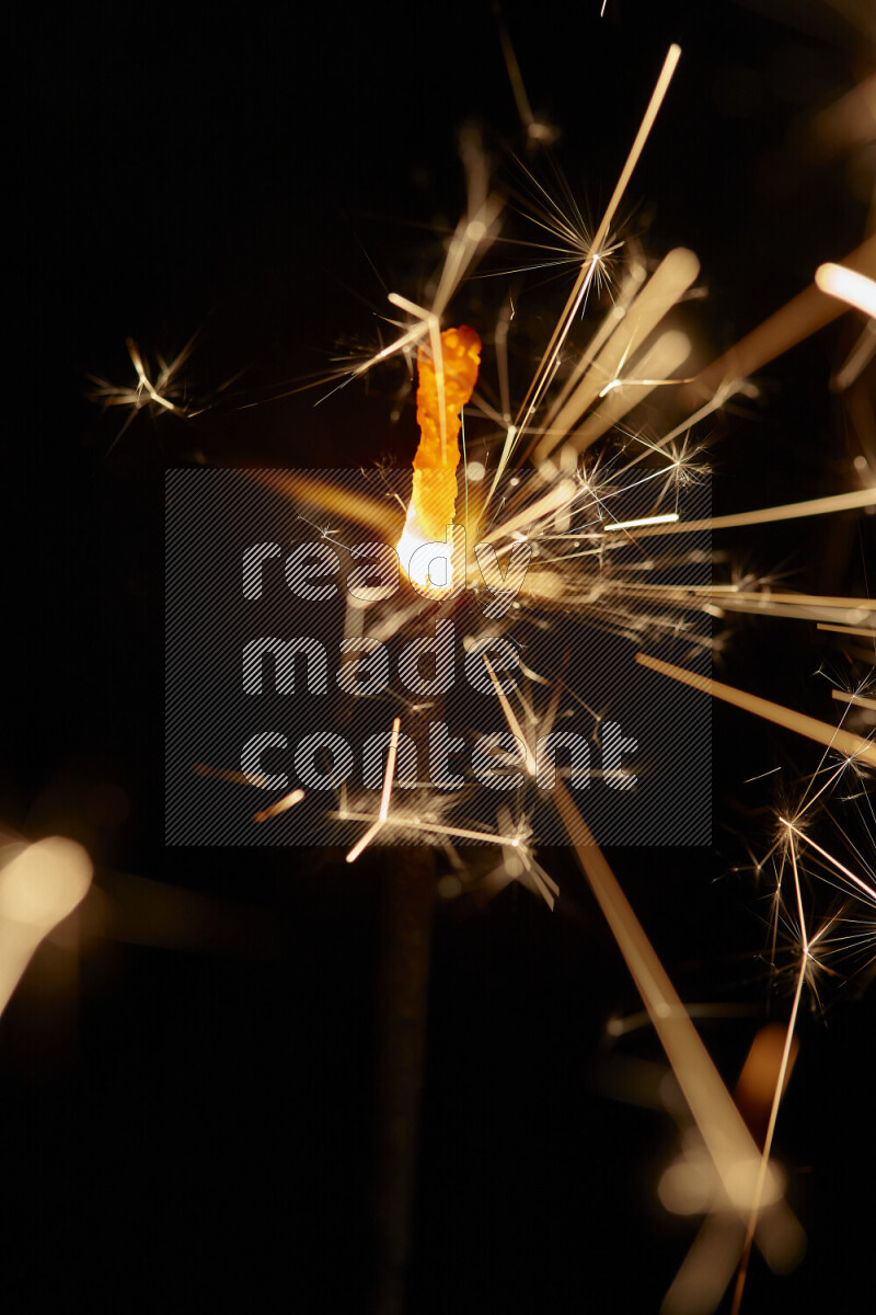 A close-up image of sparkler candle isolated on black background