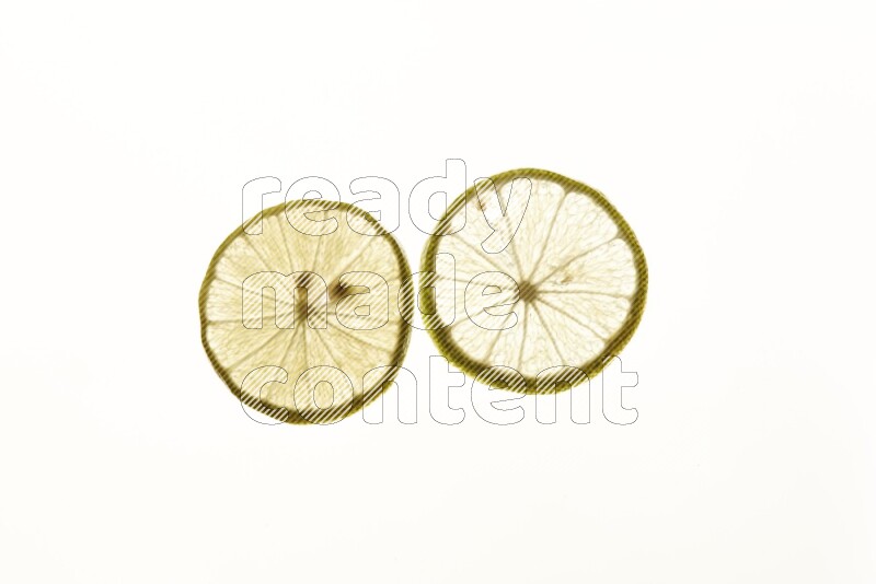 Lemon slices on illuminated white background