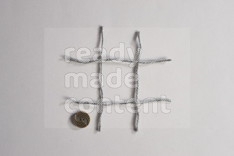 Metal buttons placed on grey background