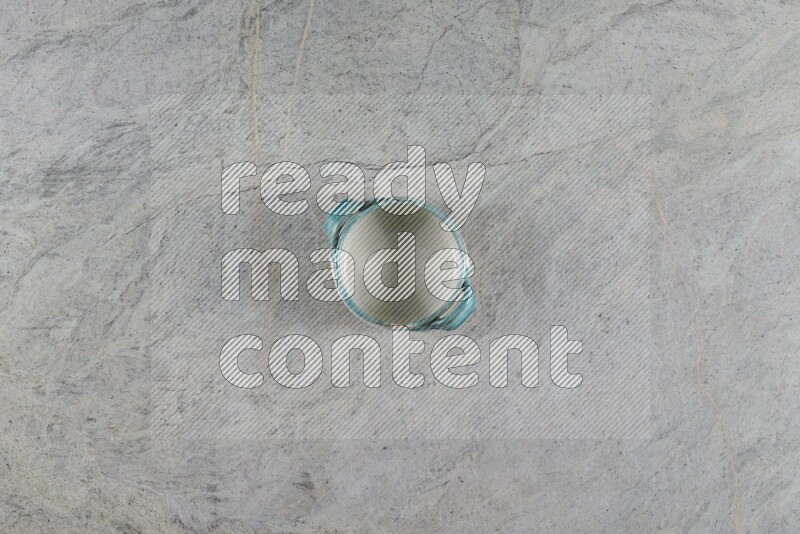 A multicolored pottery Bowl on grey marble background