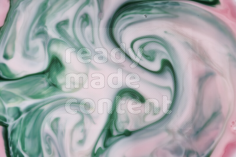 A close-up of abstract swirling patterns in red and green