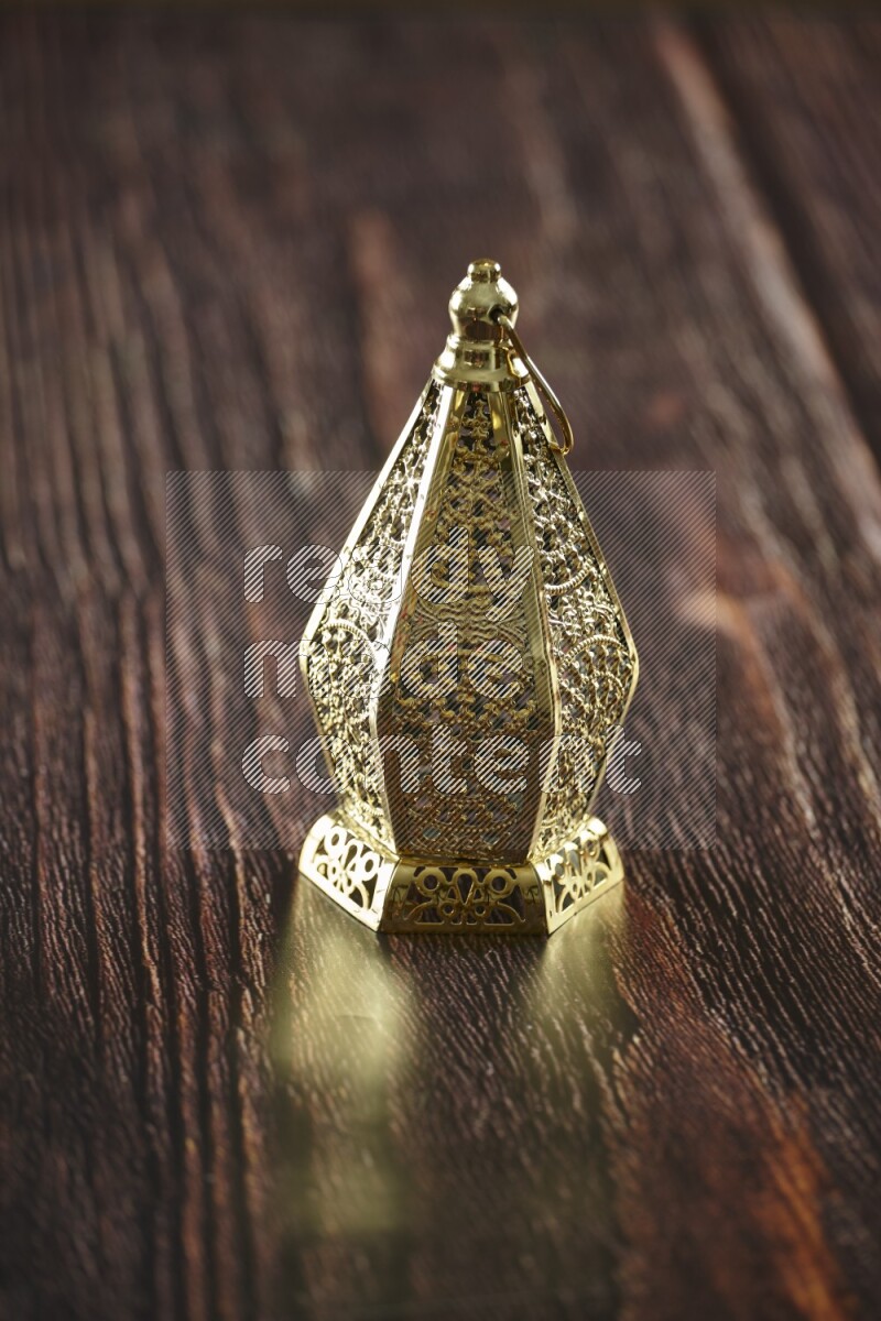 A lantern placed on a wooden background