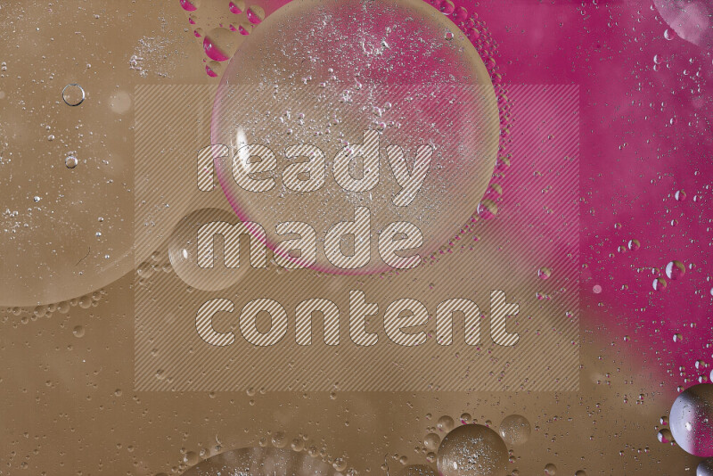 Close-ups of abstract oil bubbles on water surface in shades of pink and brown