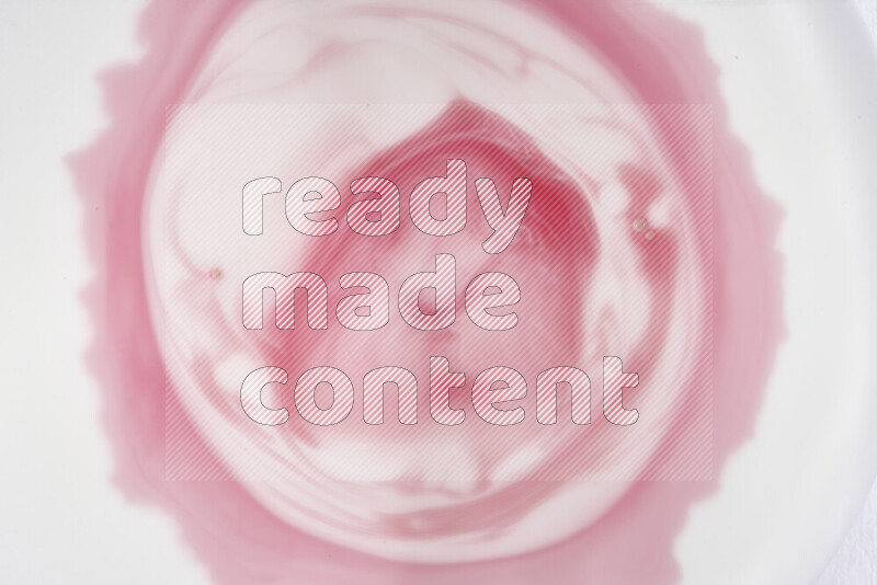 A close-up of abstract swirling patterns in red and white