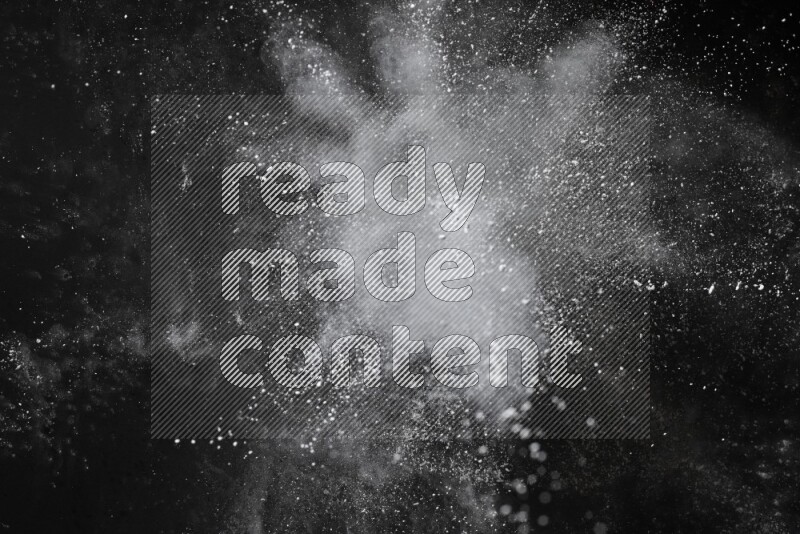 White powder explosion on black background