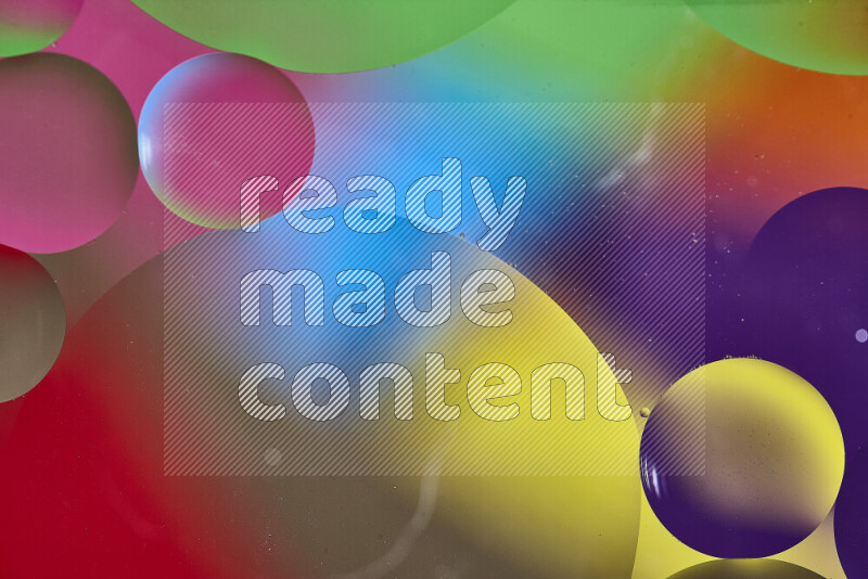 Close-ups of abstract oil bubbles on water surface in multicolors