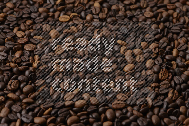 Roasted coffee beans on beige background