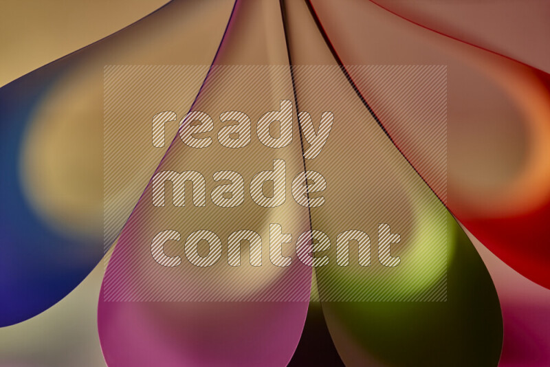 An abstract art piece displaying smooth curves in colorful gradients created by colored light