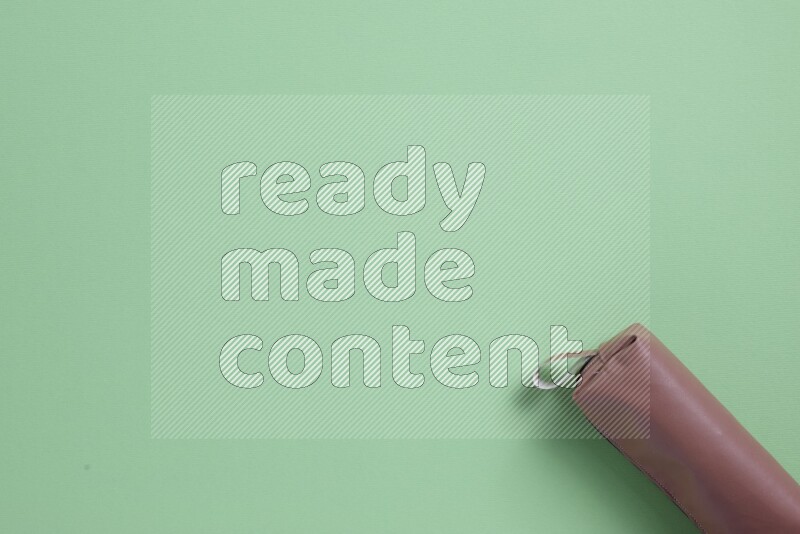 Different school supplies on green background