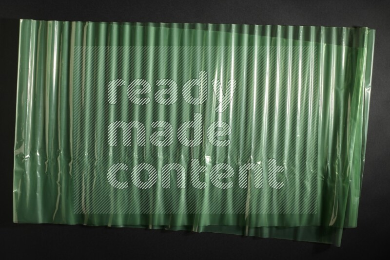 Colored plastic textures on black background