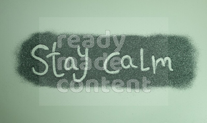 A sentence written with green glitter on green background