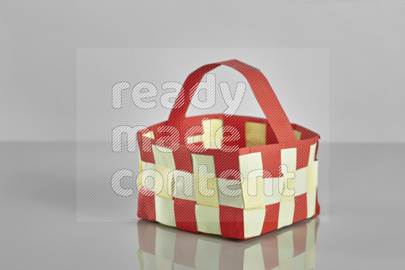 Origami easter basket on grey background