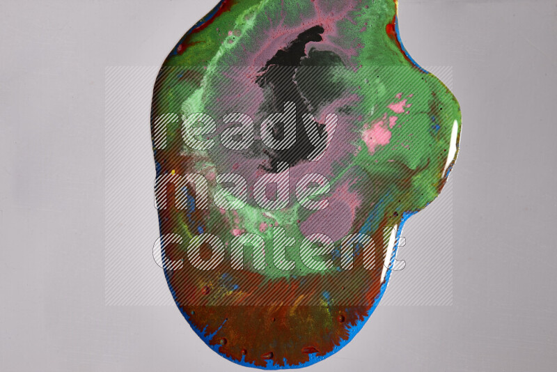 Close-ups of assorted colors blending on a grey background