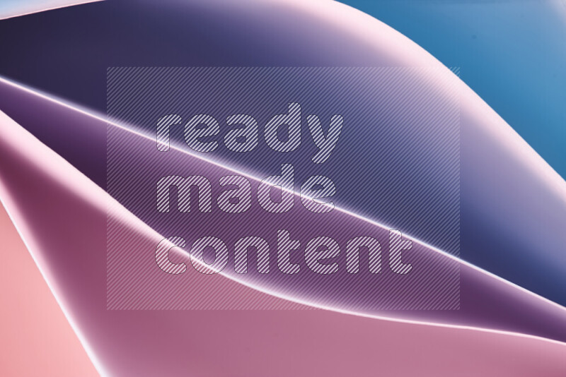 This image showcases an abstract paper art composition with paper curves in blue, purlpe and pink gradients created by colored light