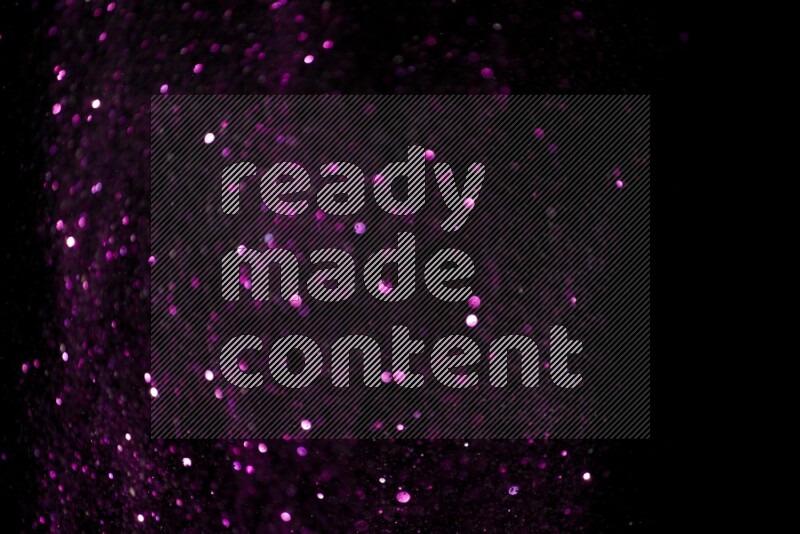 Pink glitter powder isolated on black background