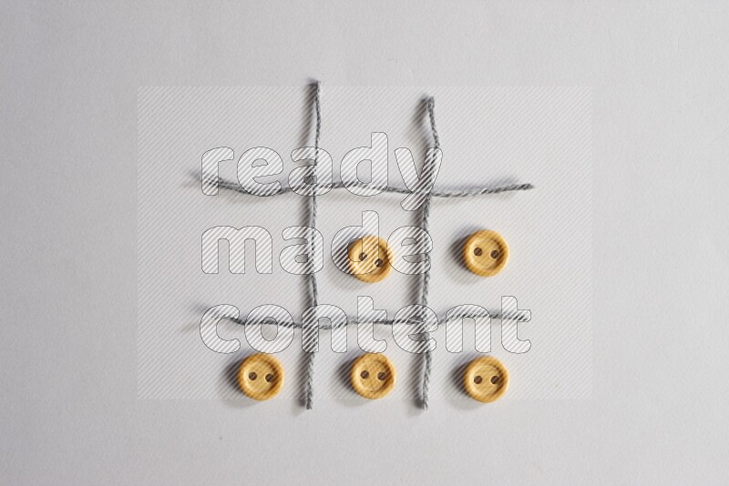 Wooden buttons placed on grey background