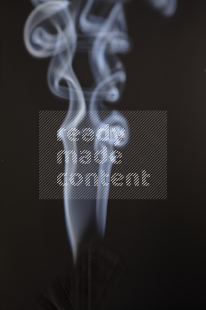Motion of wavy smoke isolated on dark background
