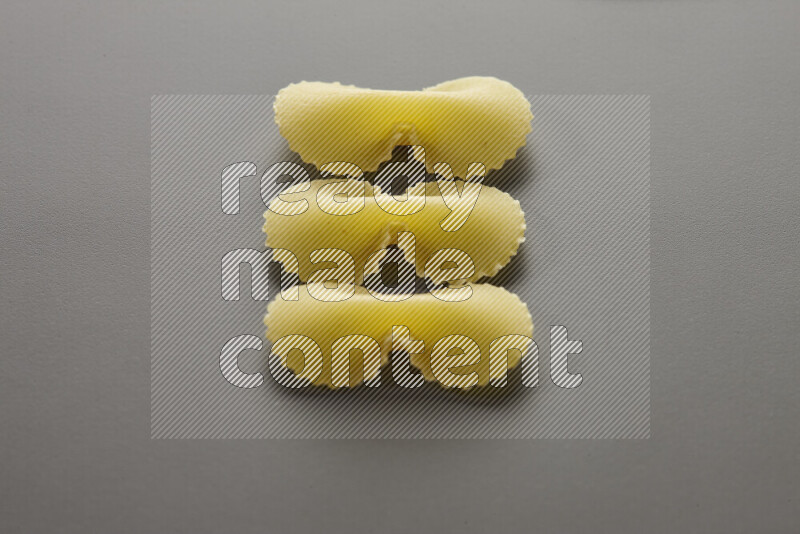 Fiocchi pasta on grey background