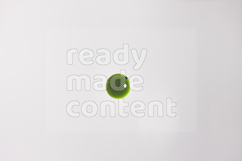 Close-ups of abstract green paint droplets on the surface