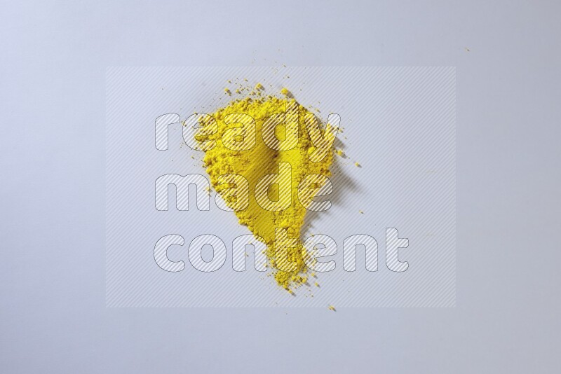 Yellow powder smears on white background
