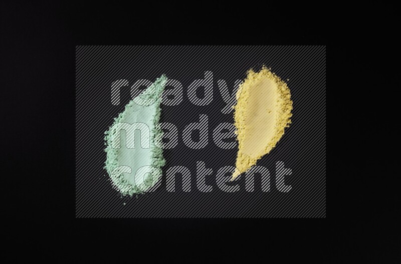 Multicolored powder smears on black background