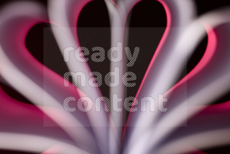 فن تجريدي يعرض منحنيات وتدرجات اللون الوردي مكونه بضوء ملون