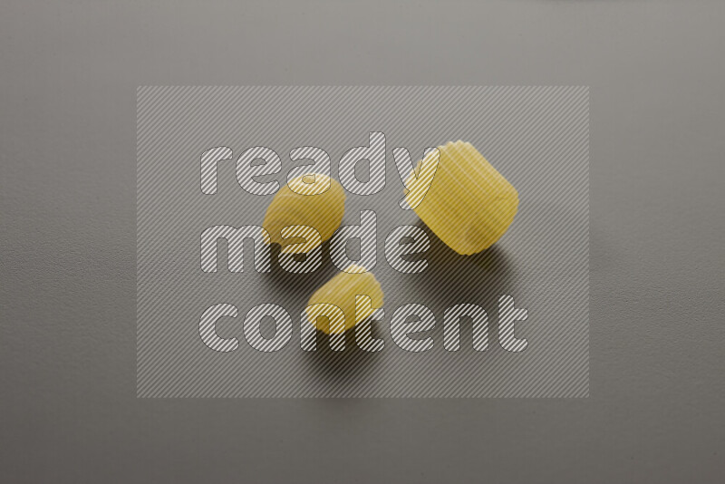Different pasta types on grey background