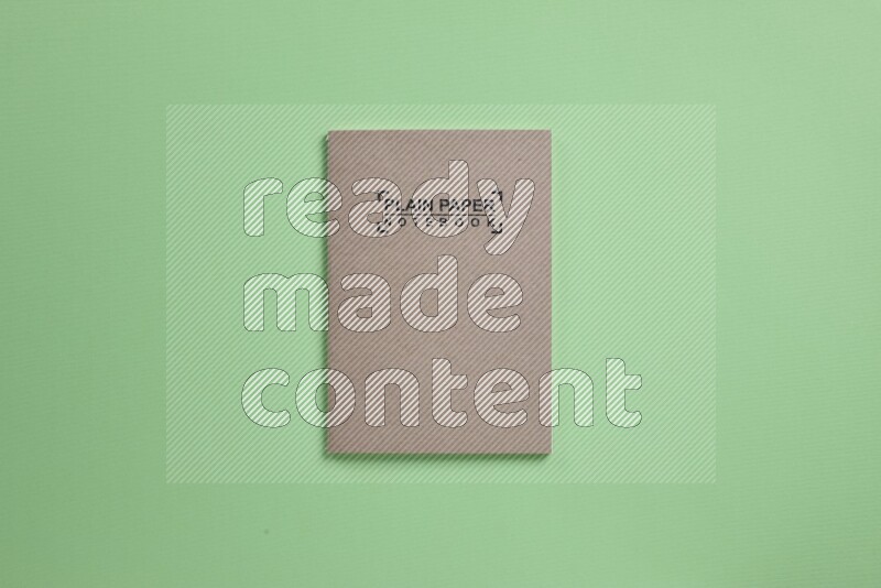 A notebook on green background