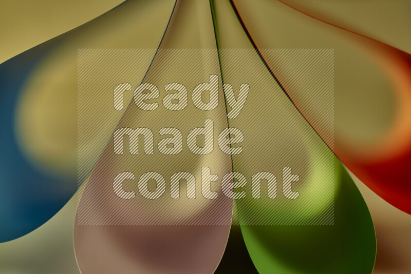 An abstract art piece displaying smooth curves in colorful gradients created by colored light