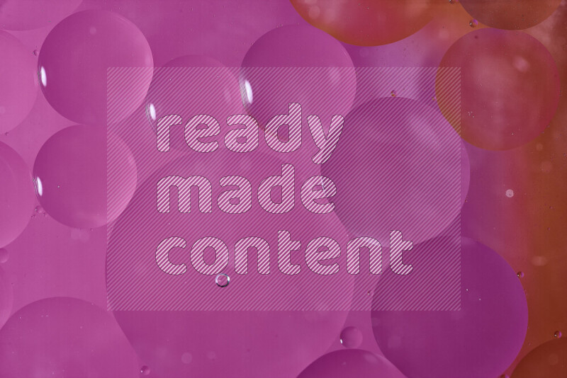 Close-ups of abstract oil bubbles on water surface in shades of orange and pink