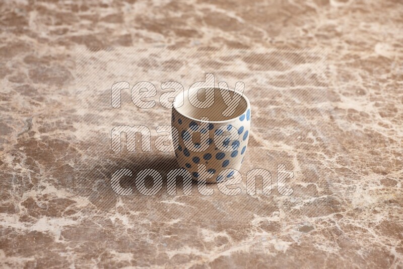 Pottery Cup on Beige Marble Flooring