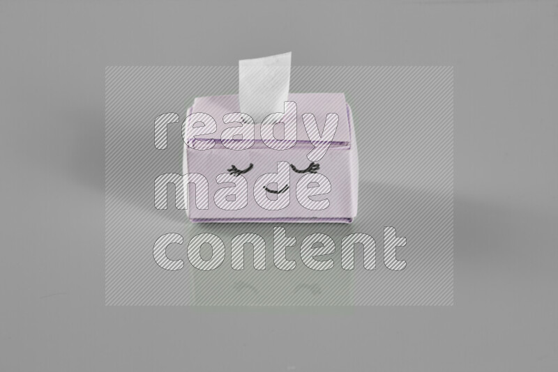 Origami tissue box on grey background
