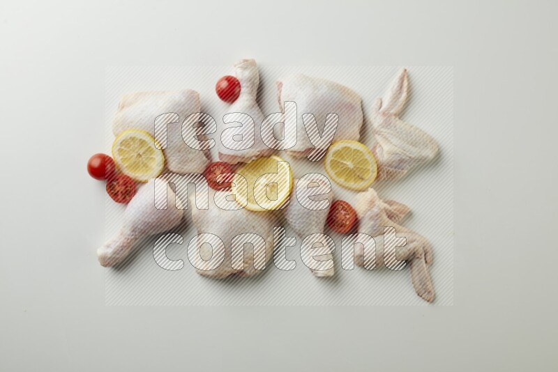 Mixed fresh chicken pieces direct on a white background