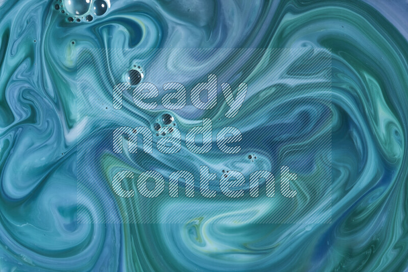 A close-up of abstract swirling patterns in blue and green