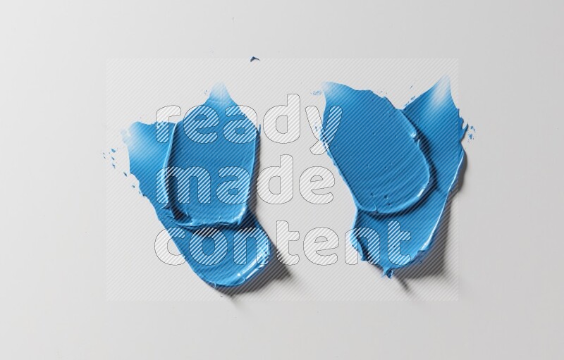 Blue painting knife strokes on white background