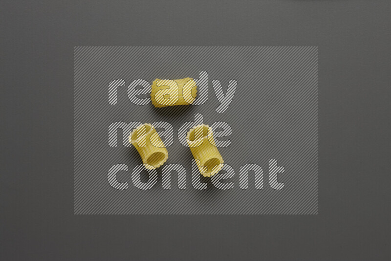 Elbow pasta on grey background